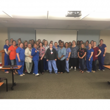 Nurses and other hospital staff in a large group