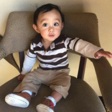 Toddler sitting in chair