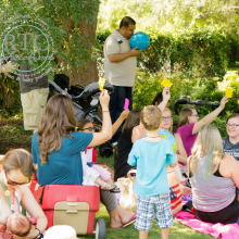 Women breastfeeding their children while outside