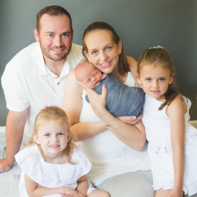 Mother, father, two young daughters, and infant son