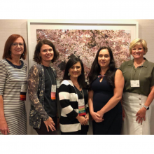 Five women at a conference