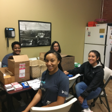 Four volunteers sitting around a table