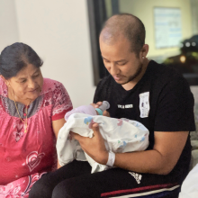 Jayden with his daddy and grandma