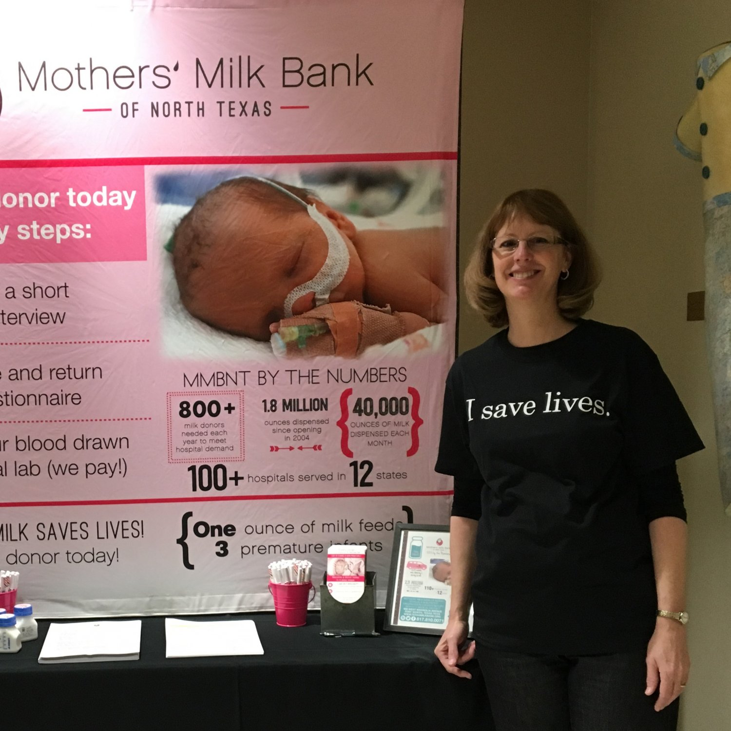 MMBNT staff standing in front of expo display