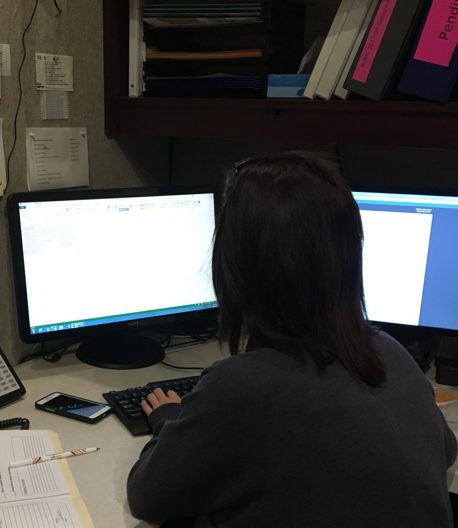 Staff person working on her computer