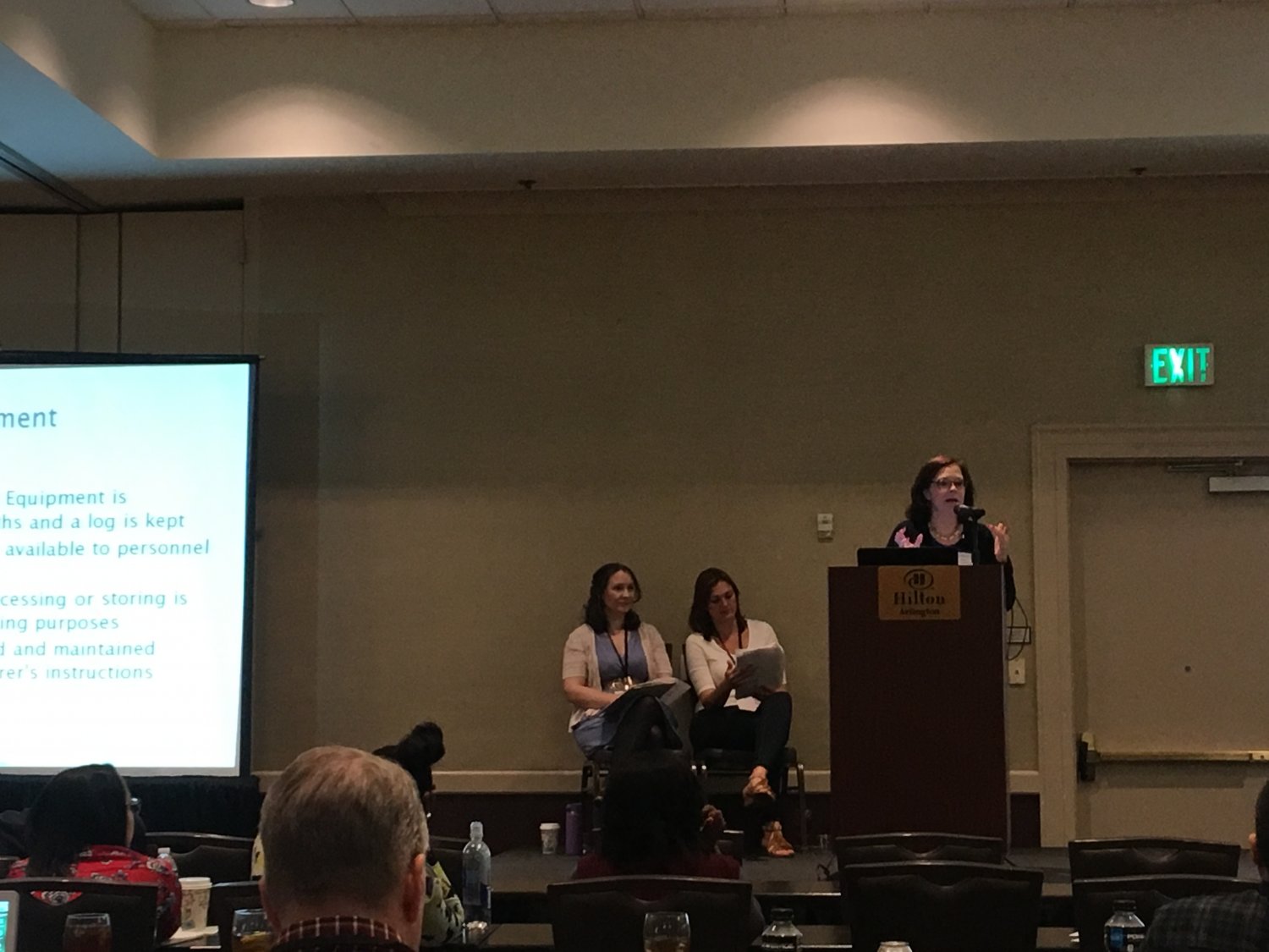 Three women leading presentation about milk banking operations