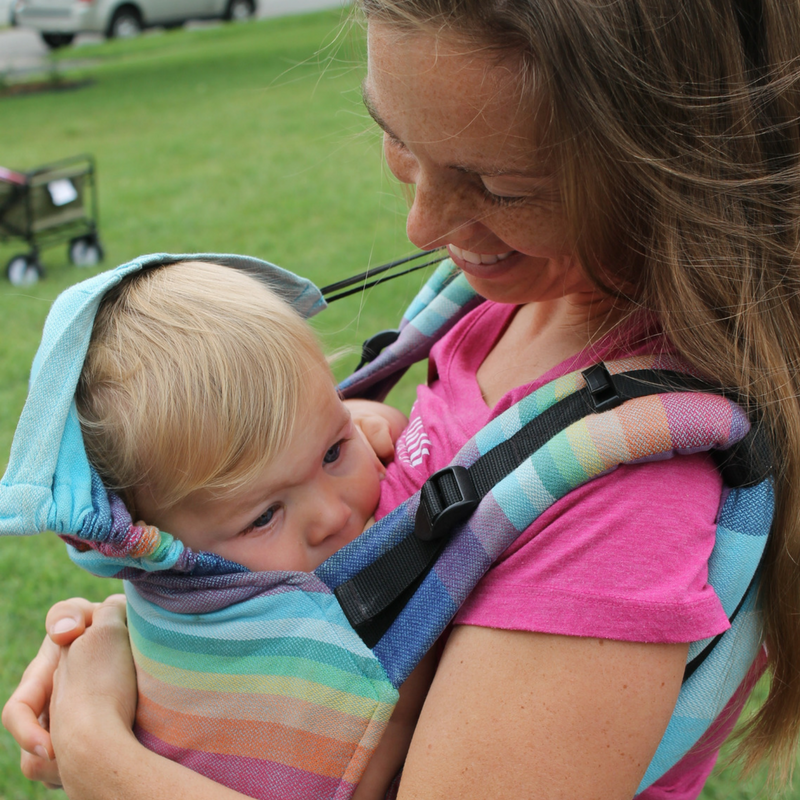 Mother babywearing her son