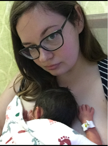 Mother holding infant son in NICU