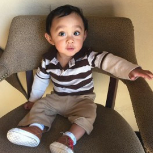 Toddler sitting in chair